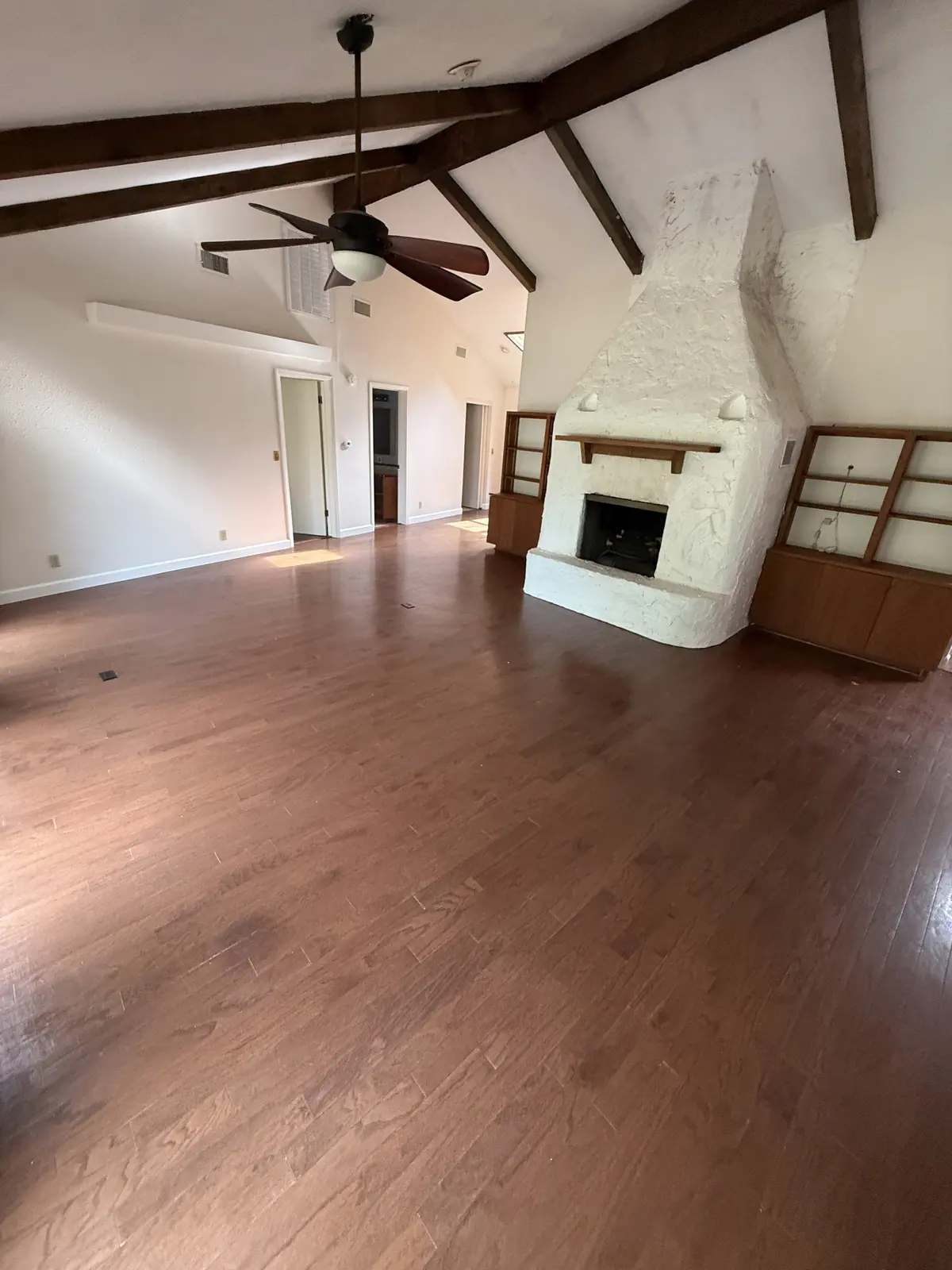 Vaulted living room with fireplace
